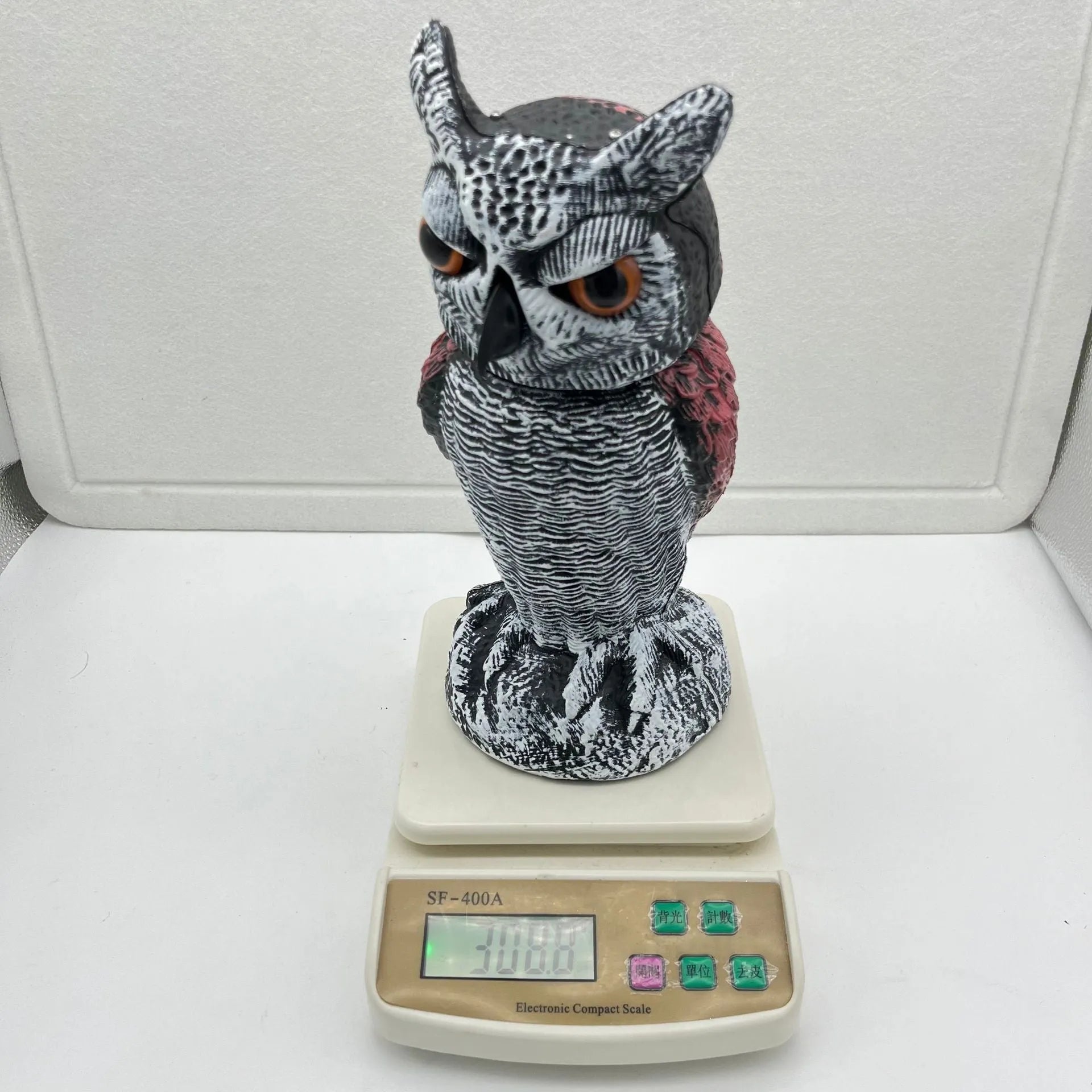 Artificial owl bird deterrent decoy with realistic features for outdoor garden use