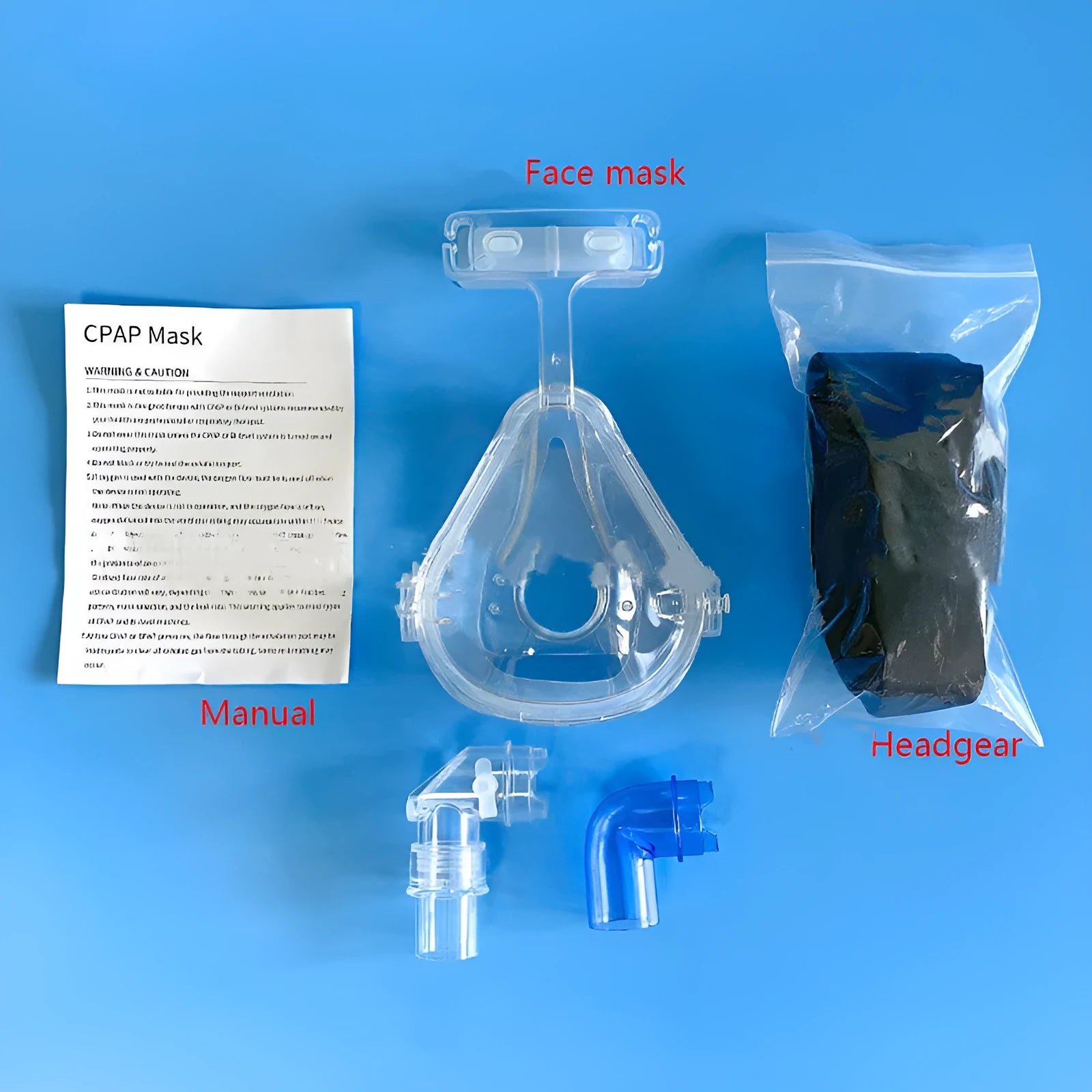 Transparent CPAP breathing mask with silicone cushion and adapter elbows for ventilator connection