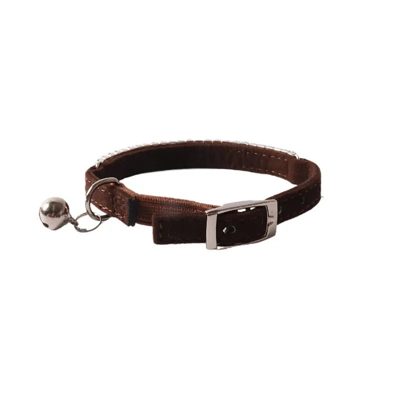 Elastic buckle cat collar in assorted colours with breakaway clasp, showing flocked material texture