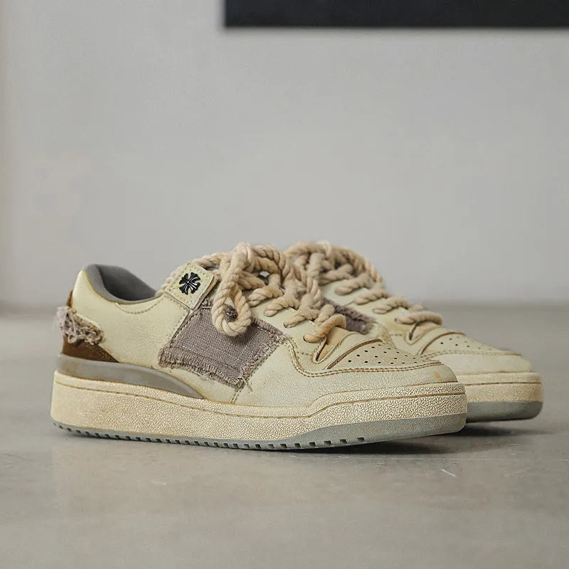 Beige low-top vintage skateboard shoes with round toe and rubber sole