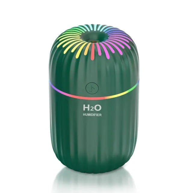White pink or green mini USB humidifier with 300ml tank measuring 75x75x116mm
