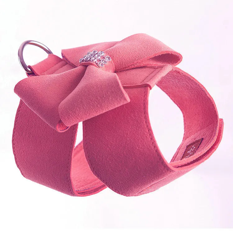 Pink bowknot dog chest strap harness on small white puppy