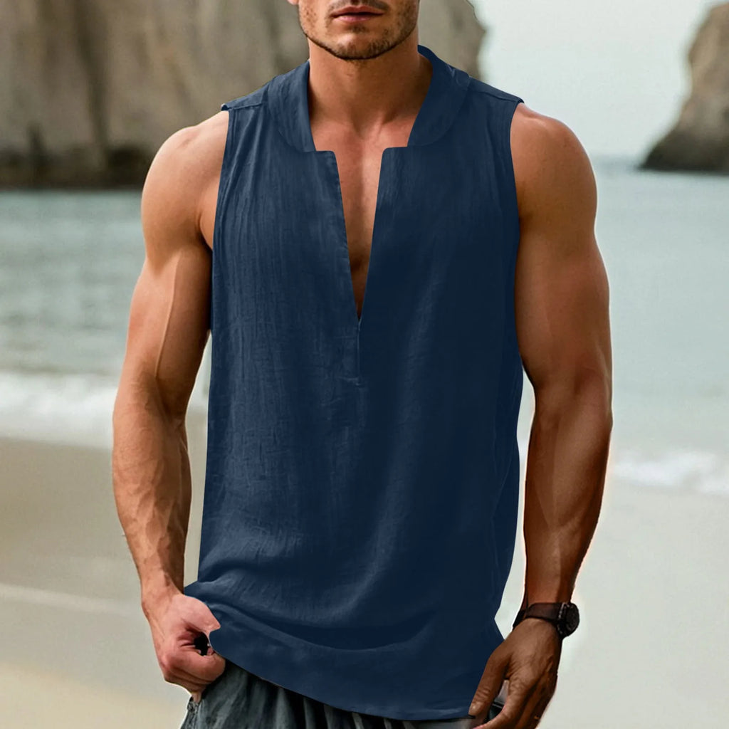 Man modelling a mint green sleeveless casual shirt made from cotton and linen fabric.