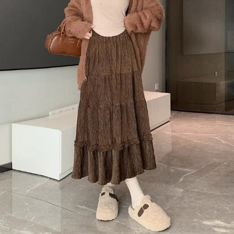 Women's solid colour corduroy A-line midi skirt with an elastic waistband shown in beige.