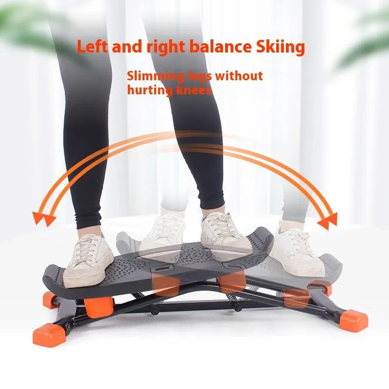 Black mini fitness skiing machine for home indoor exercise with elastic hand straps.