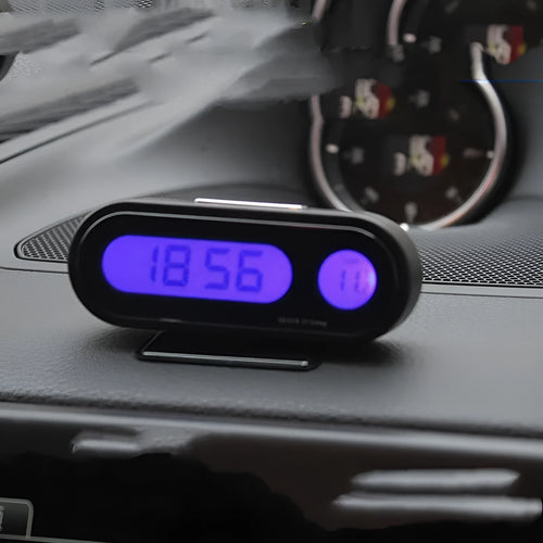 Black electronic car clock and thermometer unit with LED display on adjustable bracket.