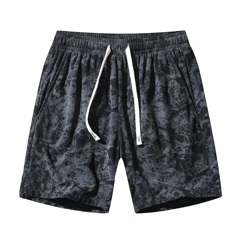 Men's straight-leg corduroy camouflage shorts in black, shown on a model.