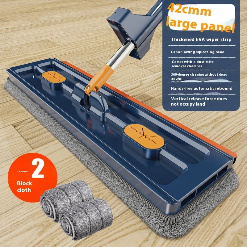 Large flat mop with long stainless steel handle and blue cleaning cloth on a hard floor.