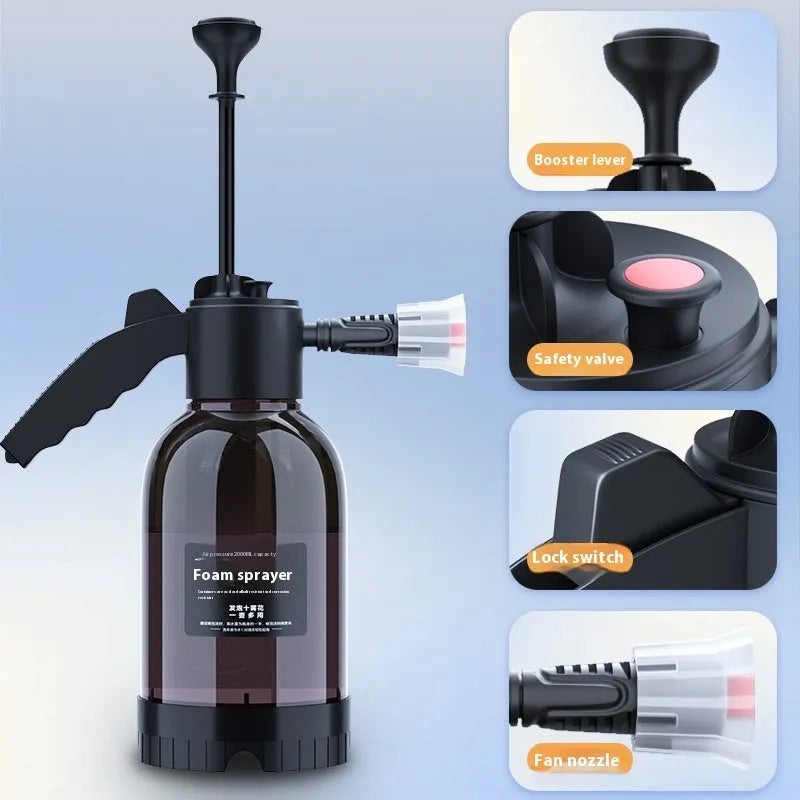 Black hand-held spray sprayer with 2 litre capacity, ergonomic handle, and two nozzles for watering and cleaning.