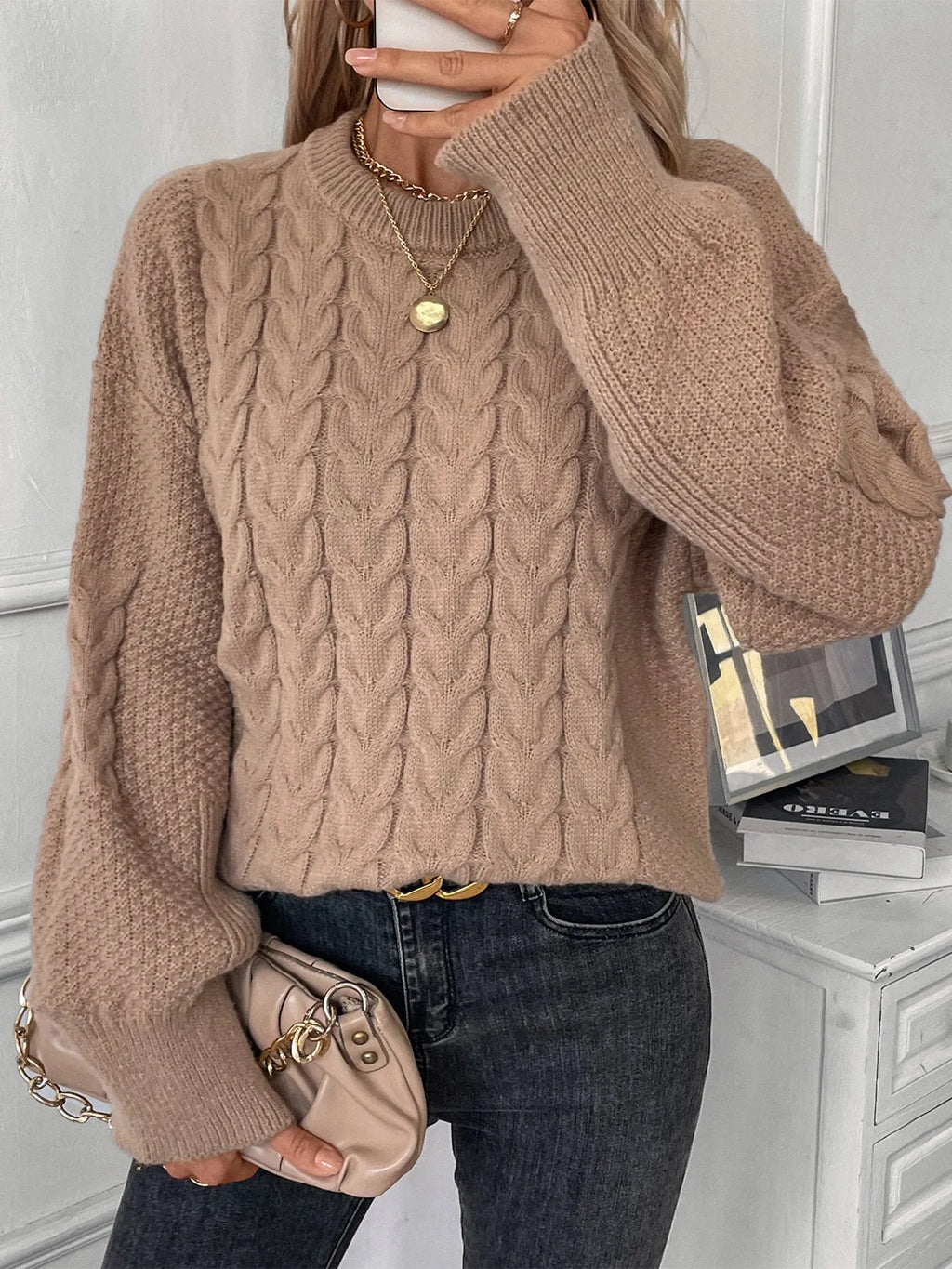 Women's khaki loose pullover sweater with round neck and twist detail on solid colour fabric