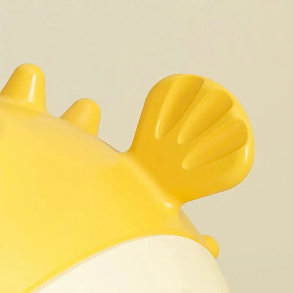 Yellow fish-shaped dog chew toy for aggressive chewers with textured surface