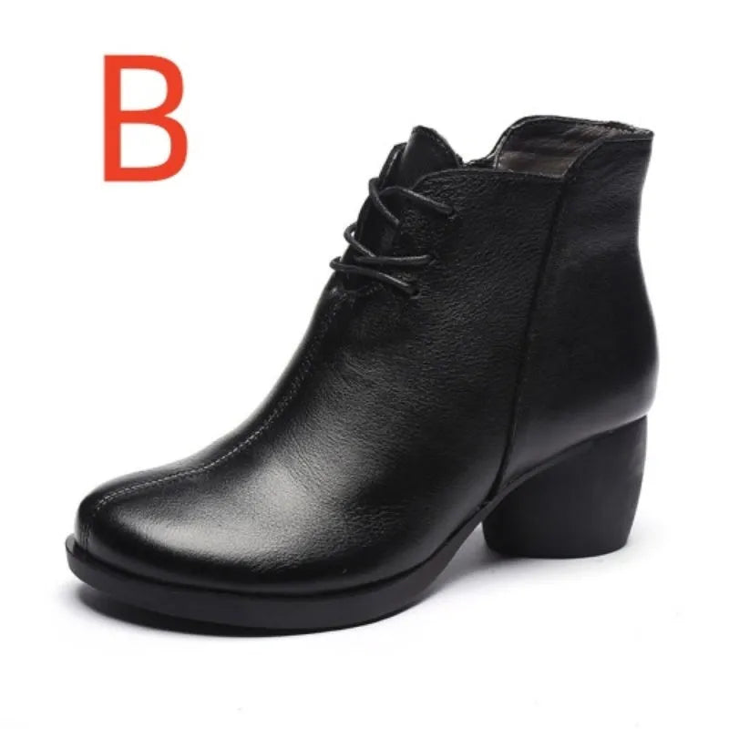 Women's black leather Martin boots with a thick, round heel and vintage styling.