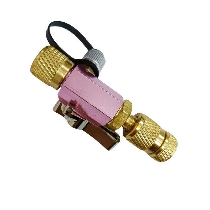 Bicycle tyre valve core disassembly tool set with black and pink removers and a small wrench.