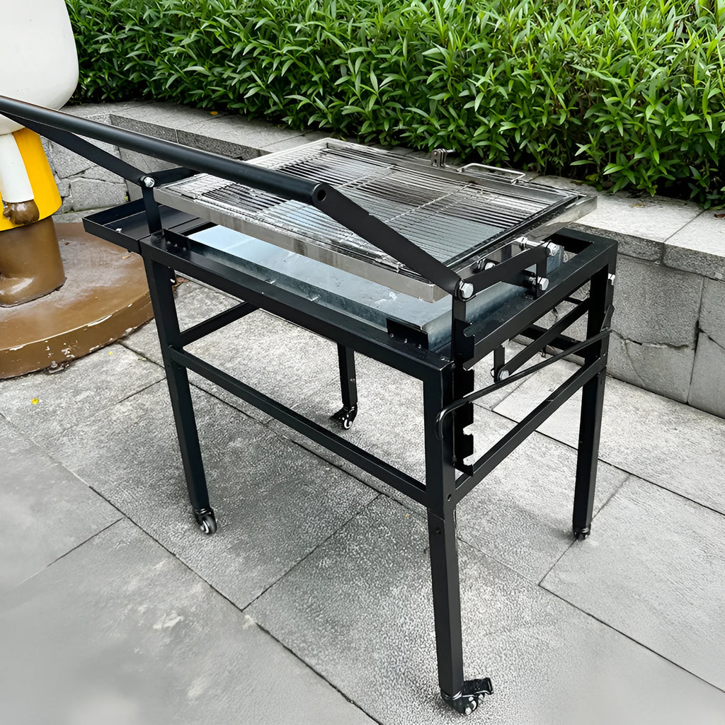 Large foldable L-size charcoal BBQ stove with grill, shown in a garden setting.