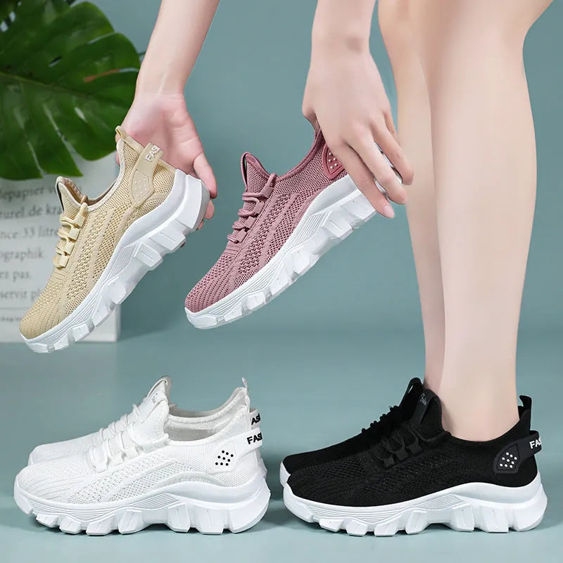 Women's white Flyknit sneaker with thick PVC sole and round toe lace-up design