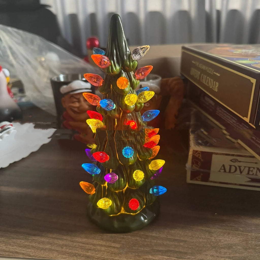 Set of European-style resin Christmas tree ornament decorations in warm and coloured light variants.