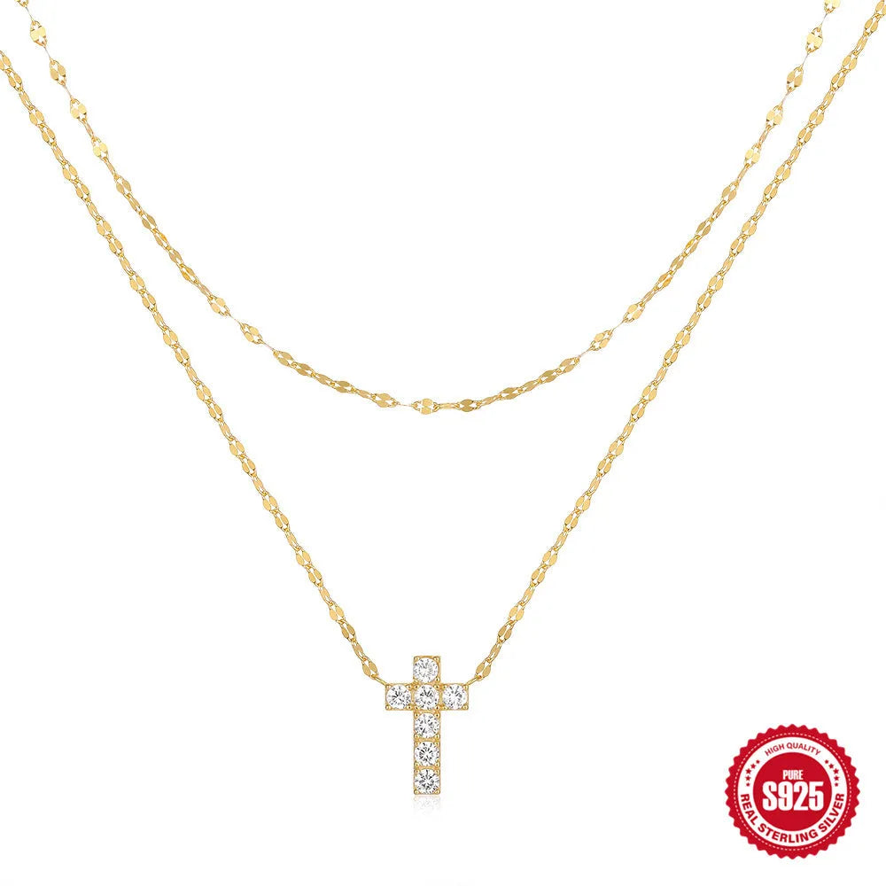 S925 sterling silver double layer cross pendant necklace with diamond accents on a clavicle chain.
