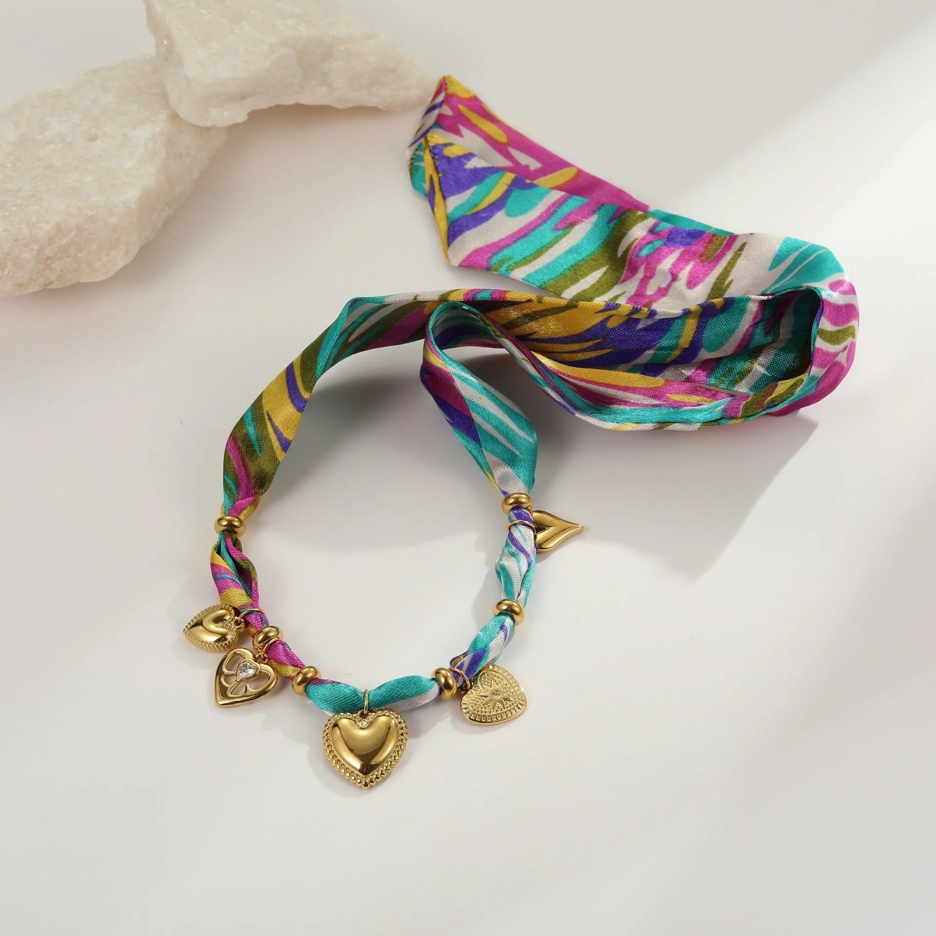 Women's stainless steel necklace or bracelet with 18K gold plating and geometric pendant design