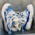 Women's grey retro platform sneakers with thick rubber sole and front lace-up closure