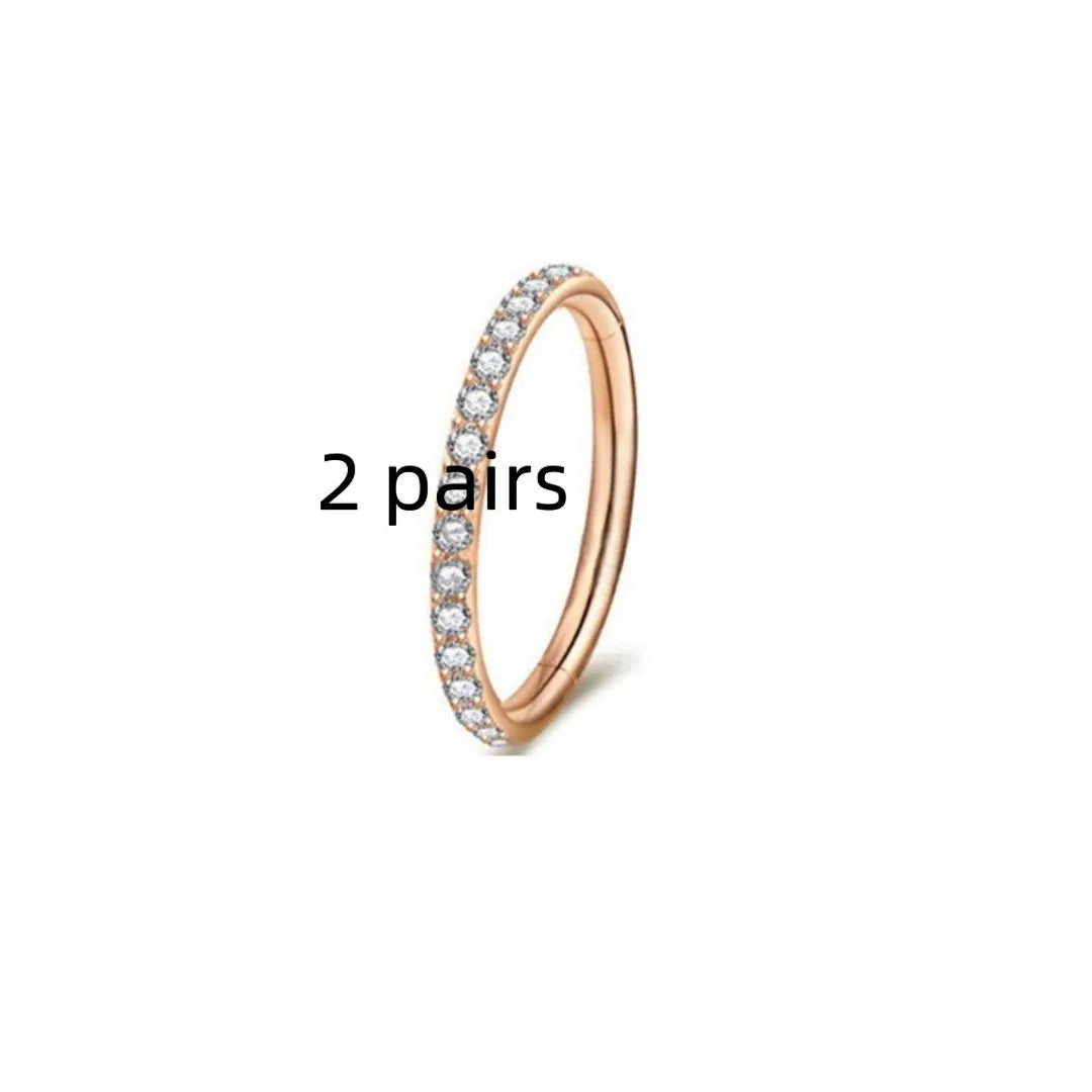 Stainless steel seamless nose ring with diamond detail showing multiple colour finishes and size options