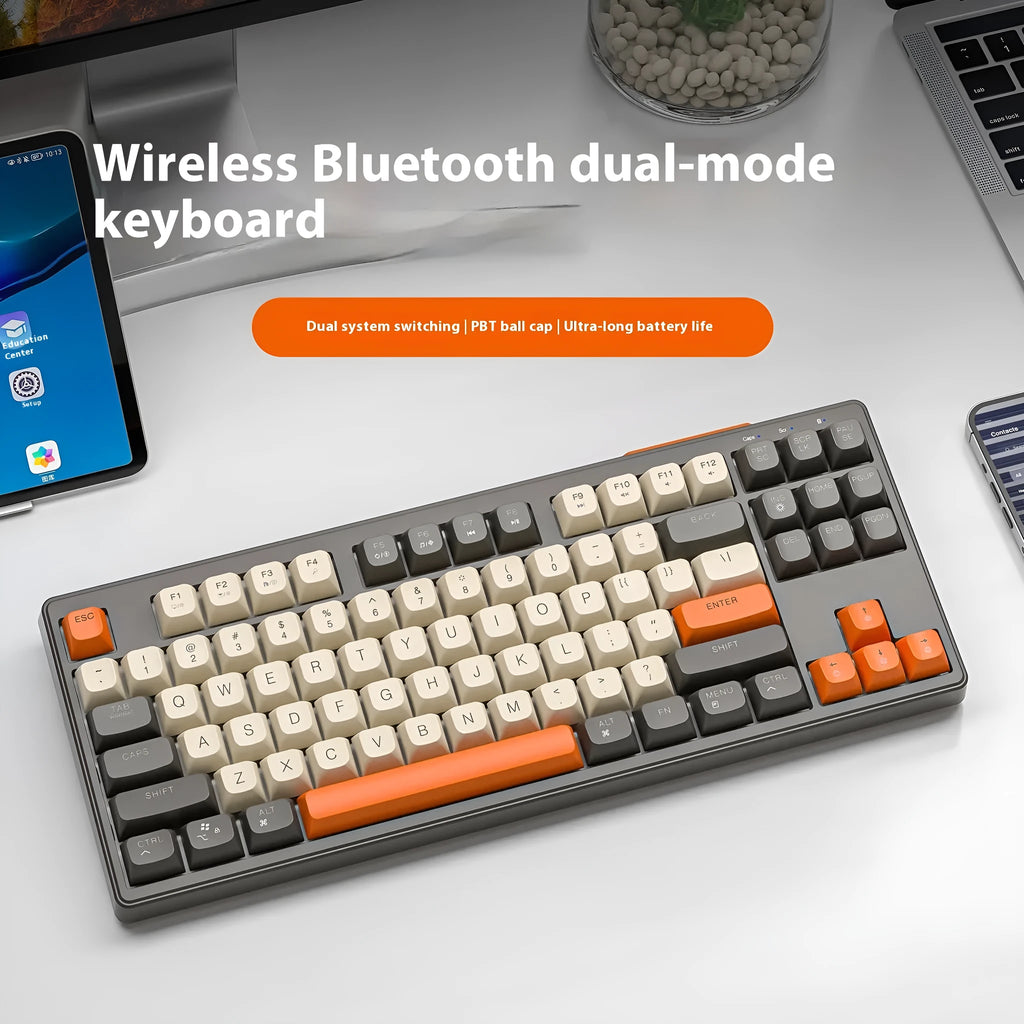 Free Wolf M87 wireless Bluetooth dual-mode mechanical feeling keyboard in blueberry colour on a desk.