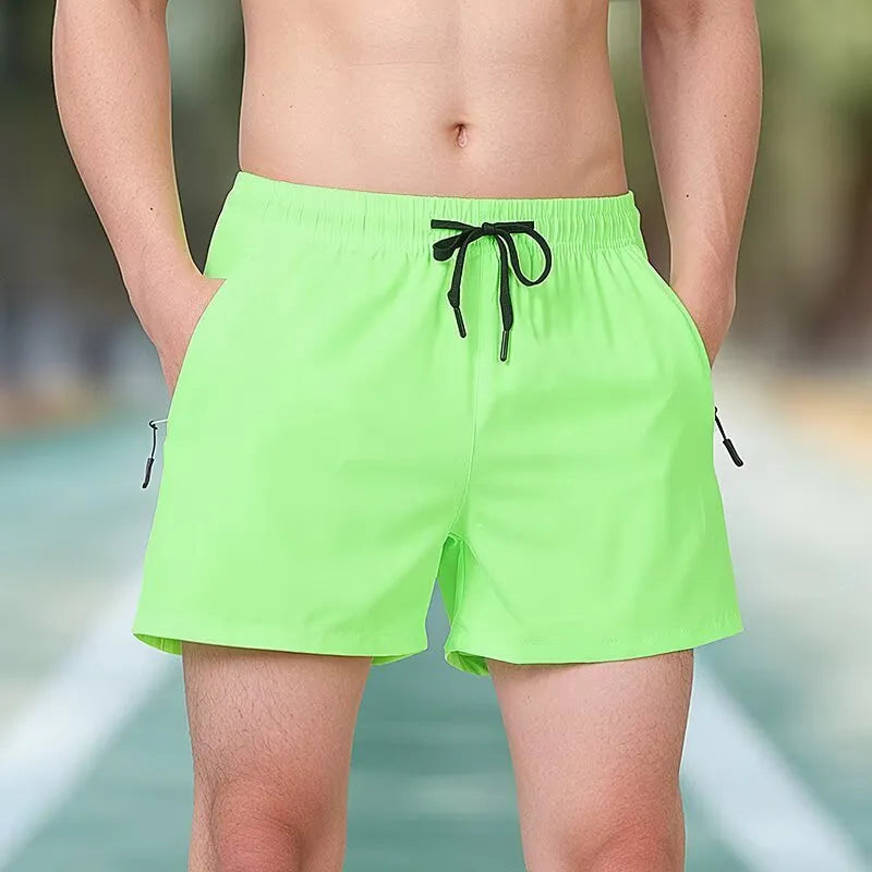 Black micro-elastic polyester men's training shorts with high waist and drawstring, laid flat.