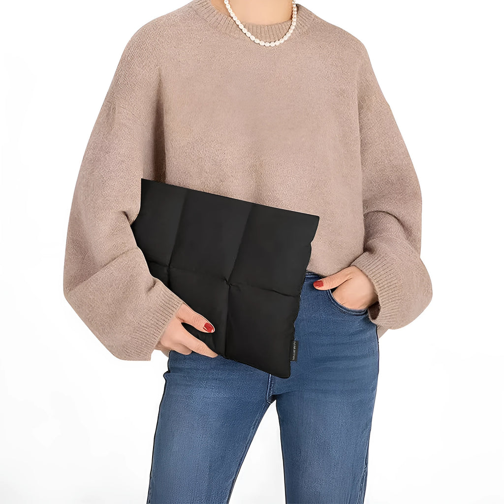 Black and khaki polyester laptop sleeve with sewing thread detail for 13 to 15.6 inch laptops.