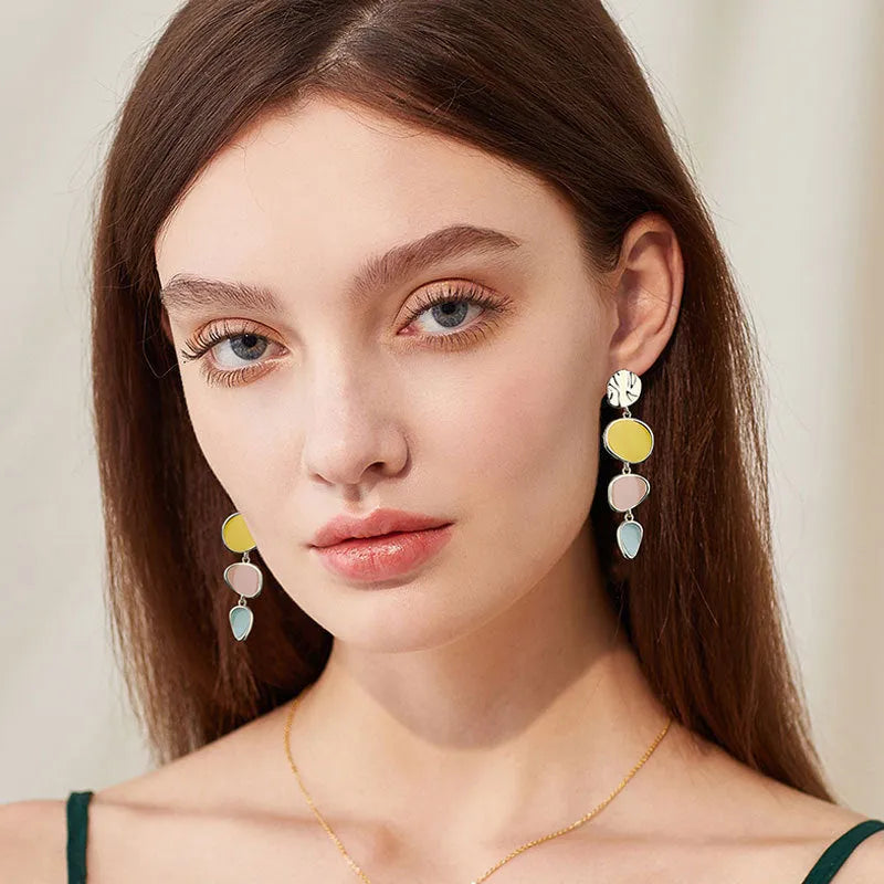 Pair of simple alloy disc earrings with a Morandi three-colour oil drip finish and sterling silver posts.