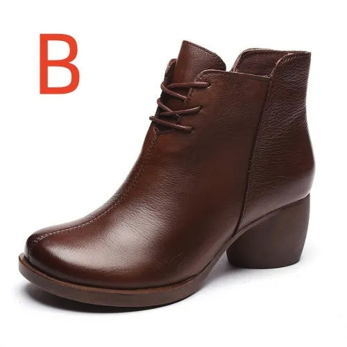 Women's black leather Martin boots with a thick, round heel and vintage styling.