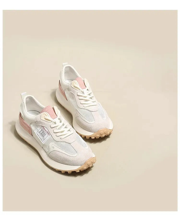 Women's grey and pink retro sneakers with mesh lining, rubber sole, and round toe design