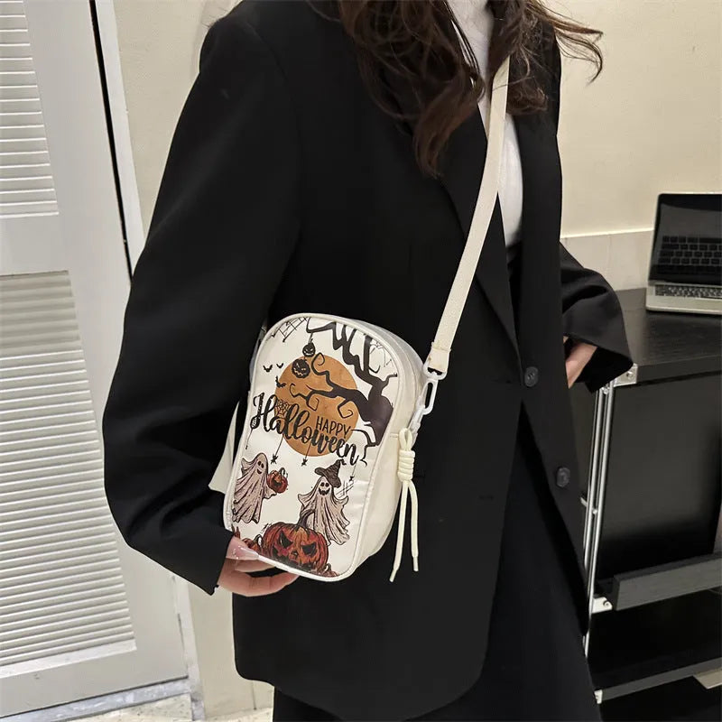 Halloween graffiti print crossbody bag showing pumpkin, ghost and bat designs in medium 14x23x9.5cm size