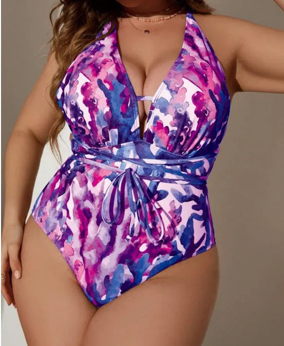 Solid blue halter neck one-piece swimsuit with brief-style bottoms on a mannequin.