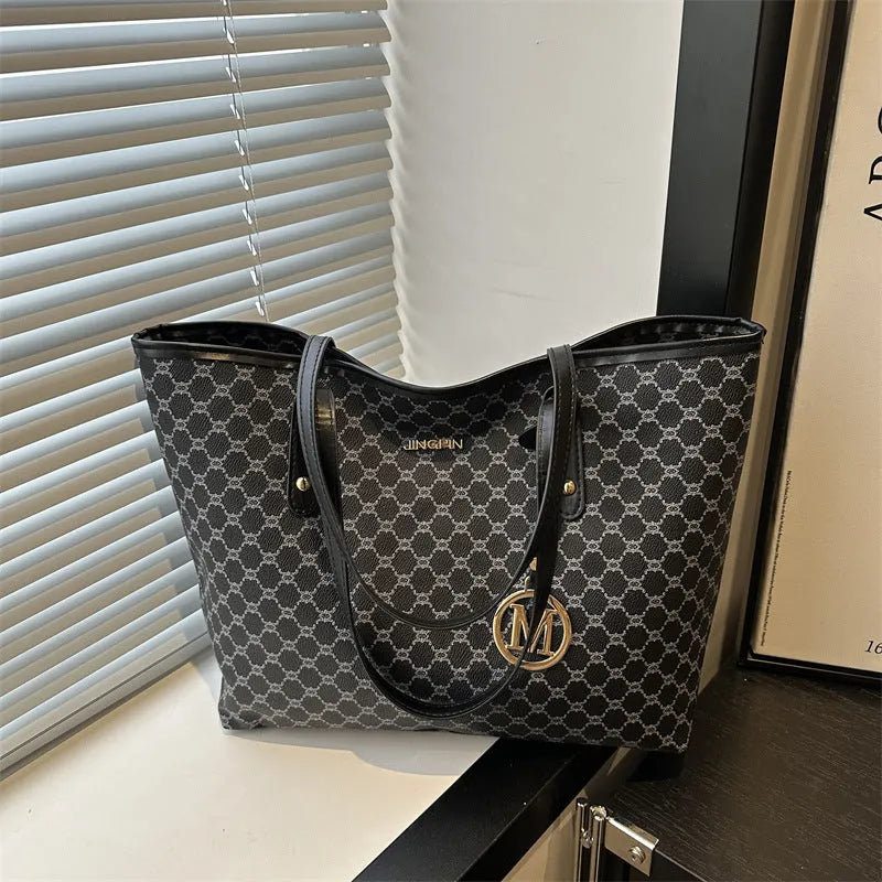 PU leather street trend shoulder bag with sewing thread detail in a choice of colours.