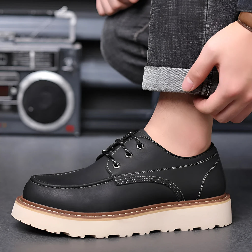Men's black retro-style Martin boots with a round toe and mid-height rubber sole.