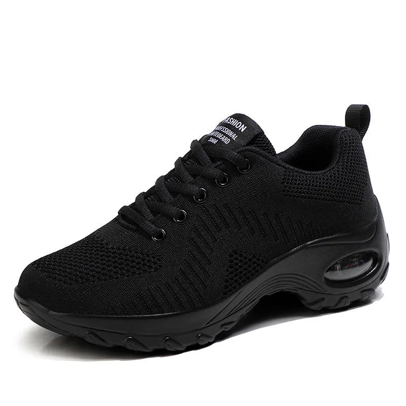 Women's black mesh sneakers with round toe and front lace-up design showing 3-5 cm mid heel
