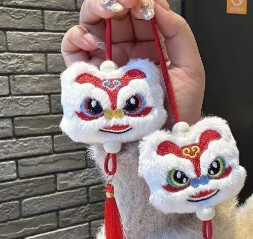 Blue and yellow handmade Chinese plush lion keychain ornament with star stone and long tassel.