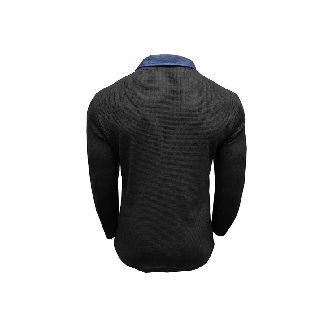 Man wearing a long-sleeved waffle-textured polo shirt in a loose fit with an asymmetric design detail.