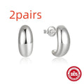 Sterling silver C-shaped stud earrings with glossy electroplated finish in gold or silver tone