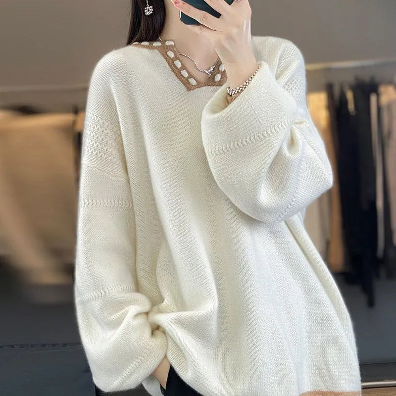 Women's camel and white V-neck viscose pullover sweater with long sleeves.