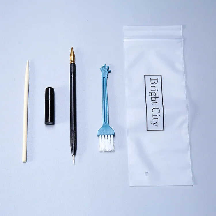 Scraping painting tools kit with white card paper, scraping pens, brushes, and art accessories for scratch artwork