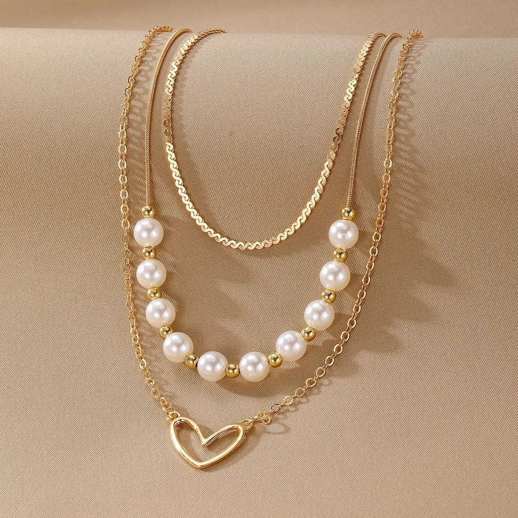 Vintage gold necklace with heart pendant on pearl chain, adjustable 41-50cm length