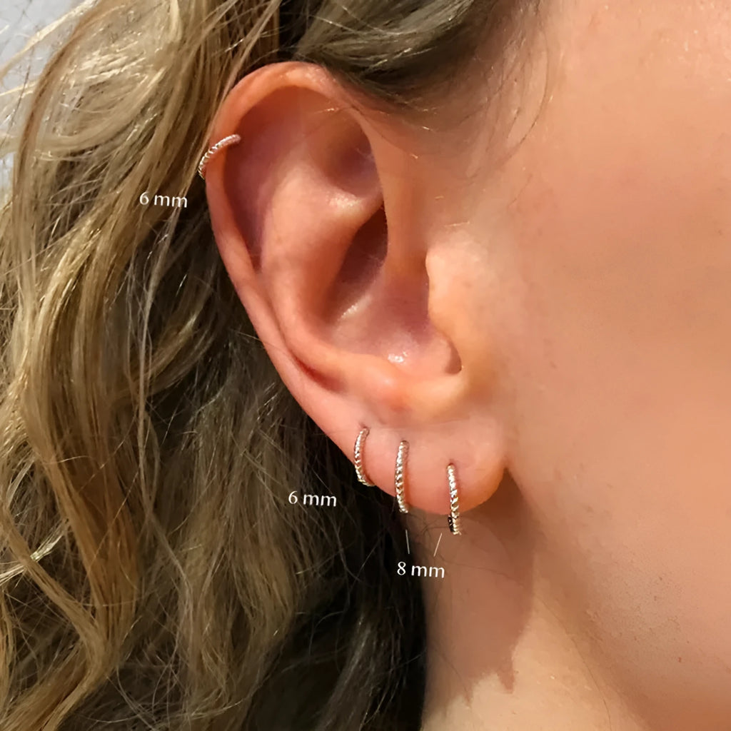 S925 sterling silver twisted string round ring geometric earrings for women on a white background.