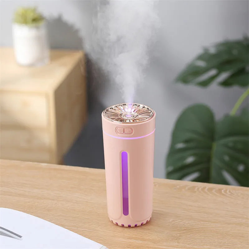 Black portable USB rechargeable humidifier with colourful LED lights and compact design for car or desktop use