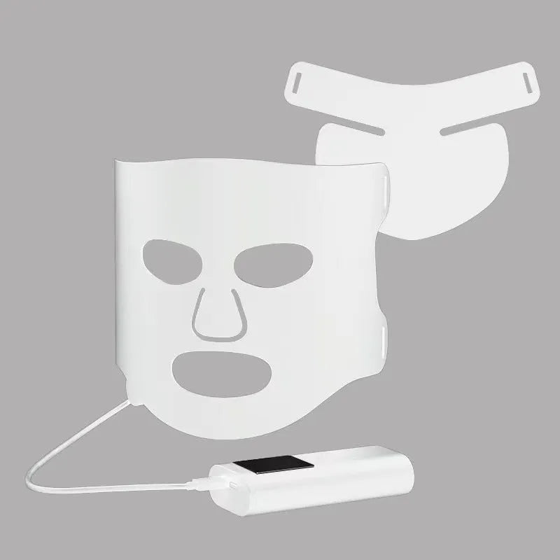Black and white LED phototherapy face mask with controller for home skin treatment.