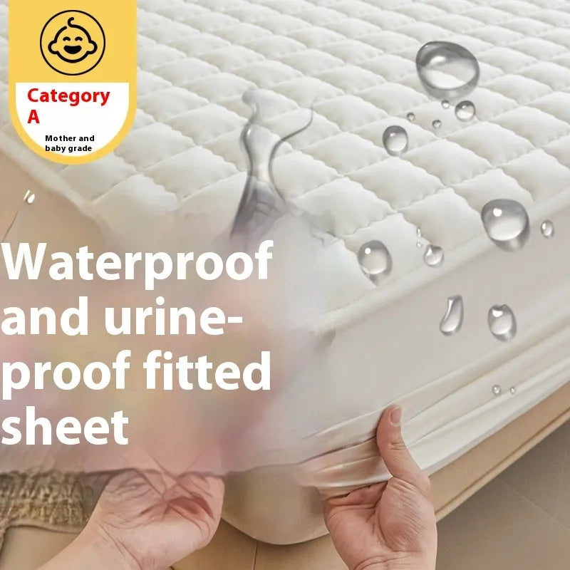 Class A waterproof fitted sheet in light grey colour, shown fitted neatly on a mattress.