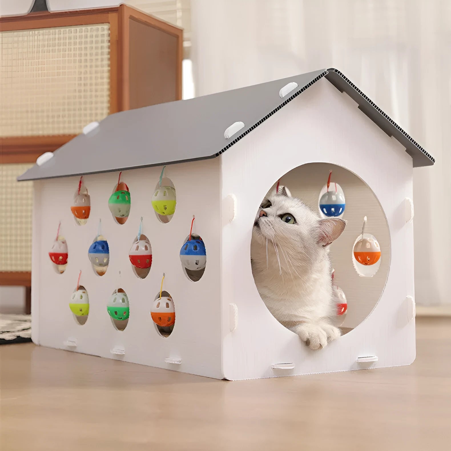 Plastic cat scratch board toy with integrated cat nest bed and tunnel, featuring a bell ball.