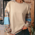 Women's loose plaid top with long sleeves in apricot colour showing Japanese-Korean casual styling