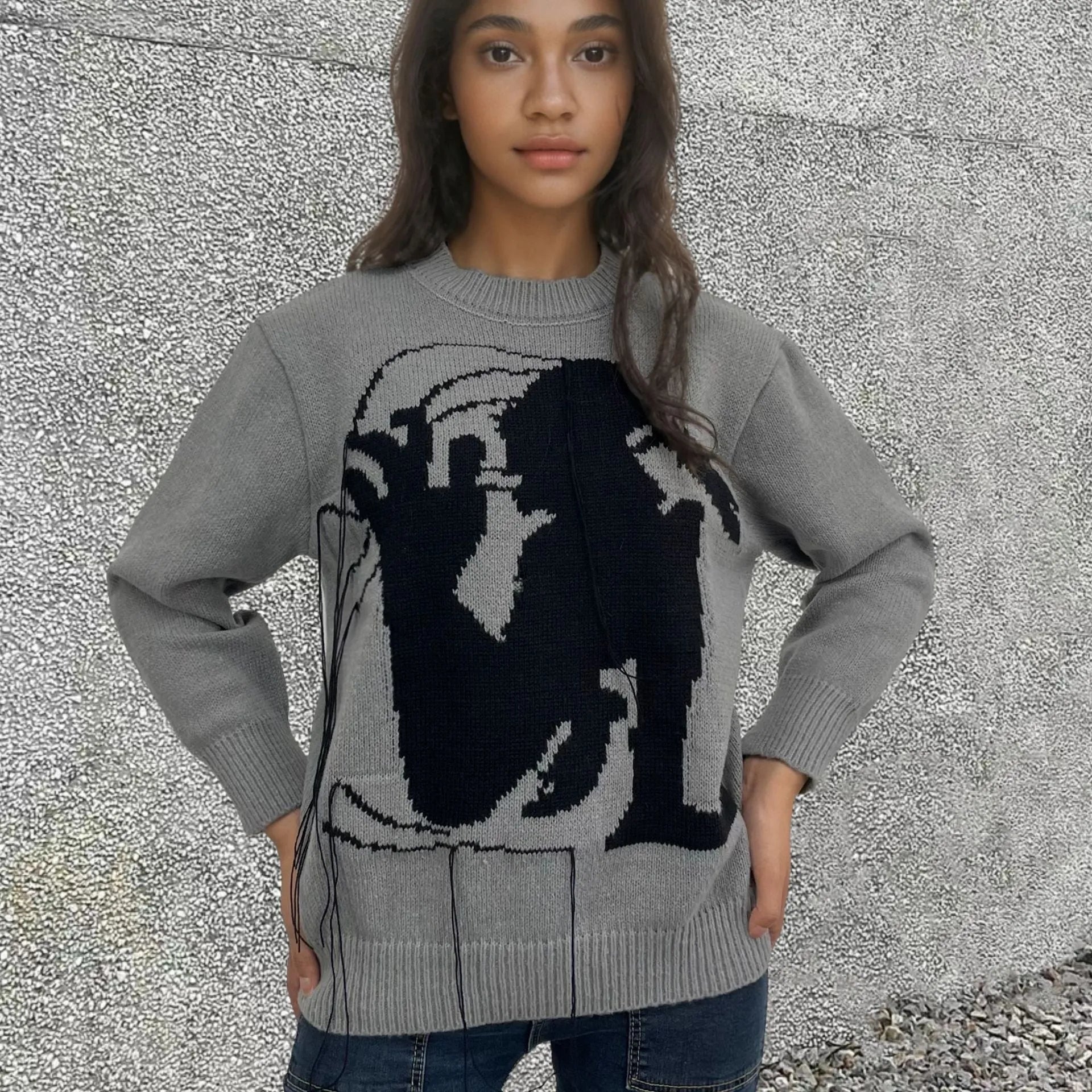 Grey alpaca wool women's sweater with tassel detail and abstract pattern