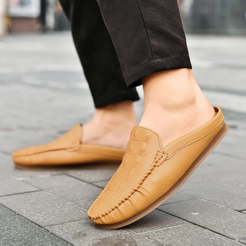 Men's black leisure semi-slipper with Gommino rubber sole and breathable artificial PU upper.