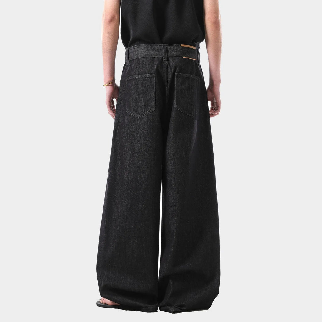 Black high waist straight leg denim jeans on a neutral background.